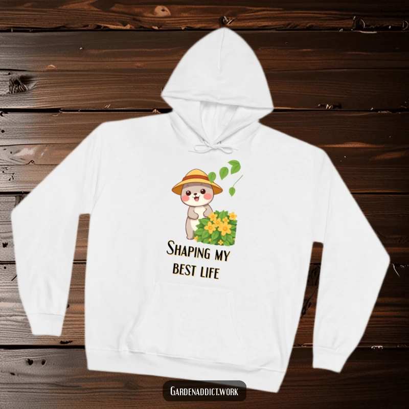 Funny gardener hoodie with a happy animal character wearing a sun hat, pruning a leafy bush, perfect for cool weather.